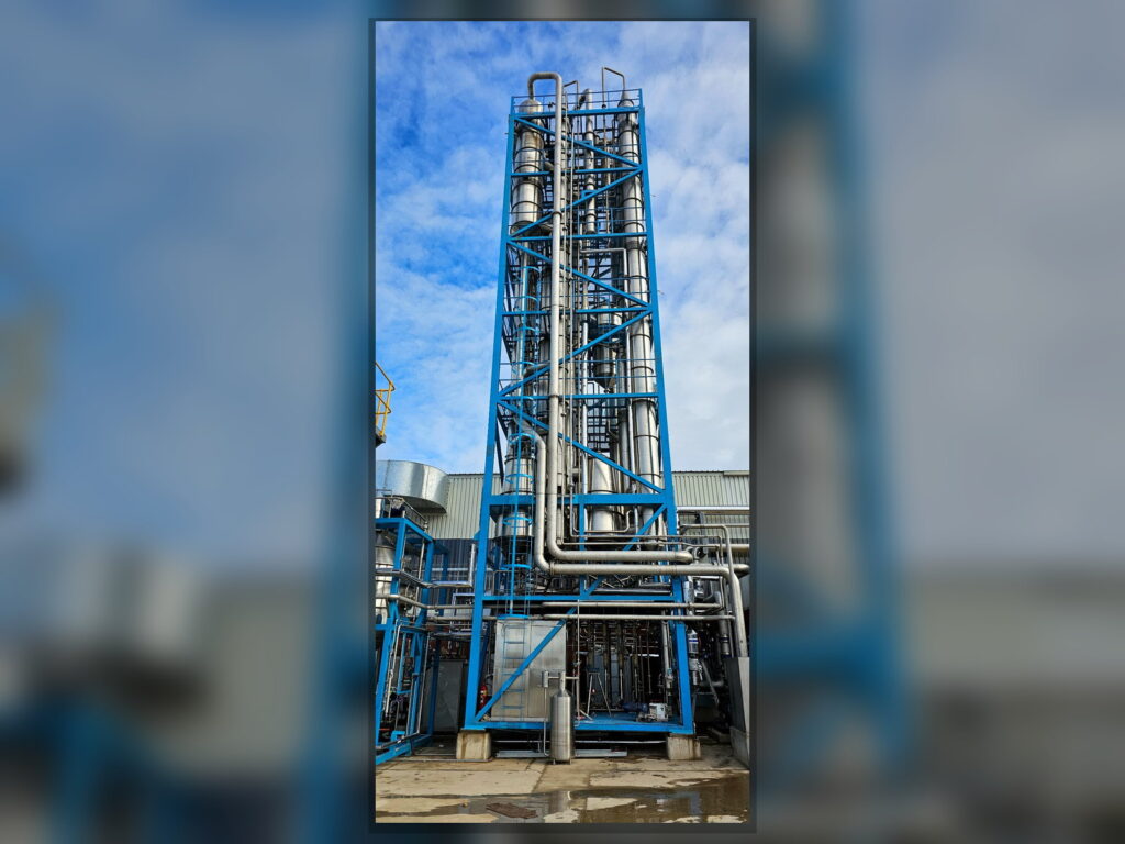 FPM GLOBAL TASTE evaporator tower installed at an industrial food processing facility.